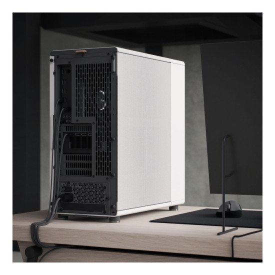 Fractal Design North Chalk FD-C-NOR1C-03 with PC wires coming out of it, placed next to a monitor